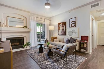 A living room with a couch and a fireplace